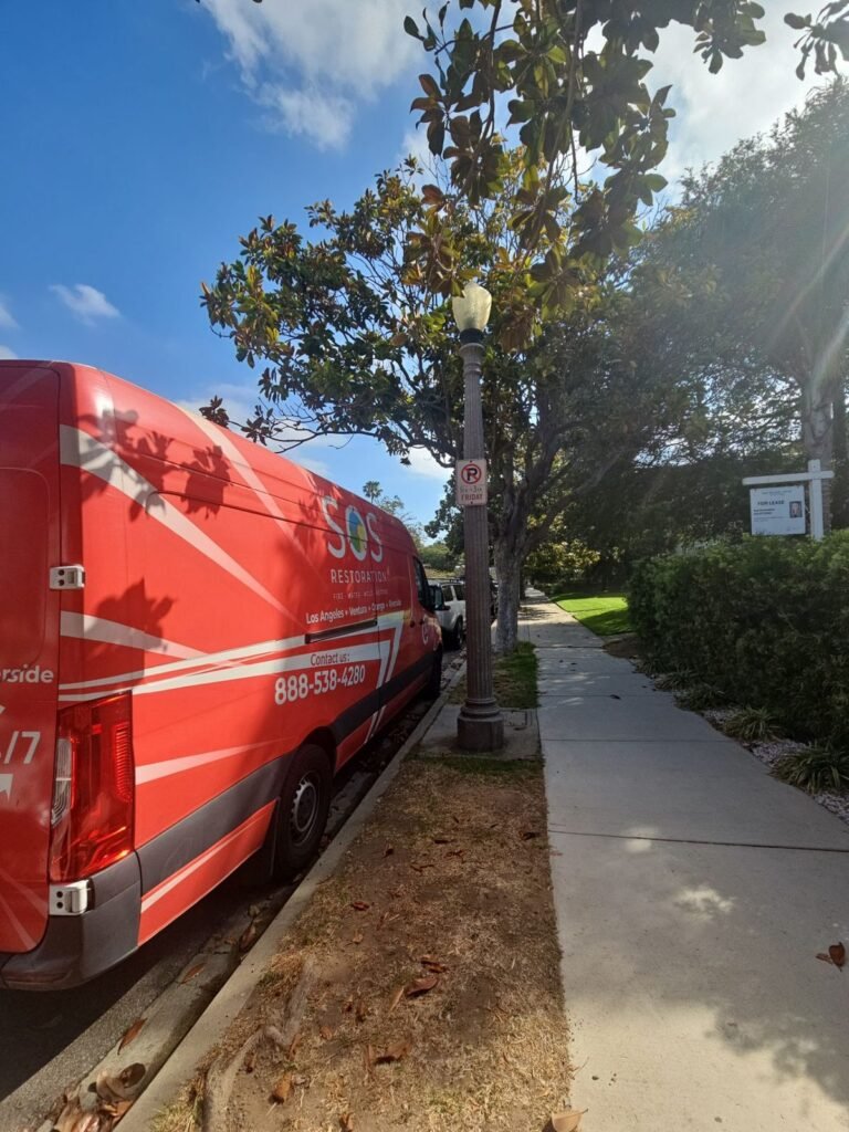 The SOS van parked on a tree-lined residential street in the East Bay
